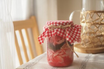Colorful jar of homemade fermented vegetables on a table