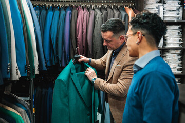 Vendor Presenting Green Suit Jacket to Customer