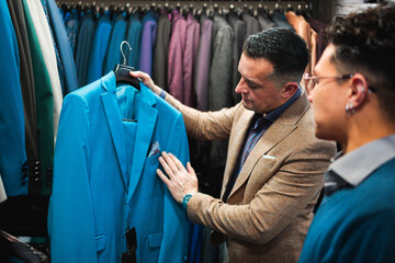 Vendor Presenting Bright Blue Suit to Customer