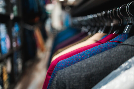 Elegant suit jackets displayed on hangers
