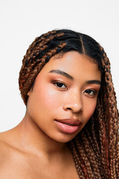 Portrait of a confident beauty with warm makeup