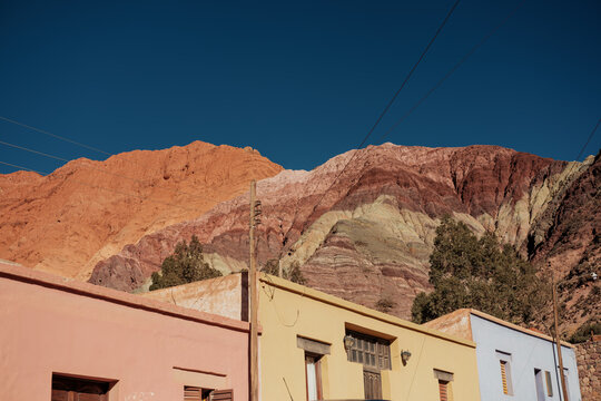 Colorful Adobe Houses Against Stunning Mountain Backdrop