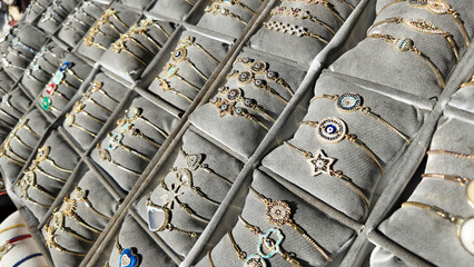 Jewelry display featuring colorful bracelets in a market