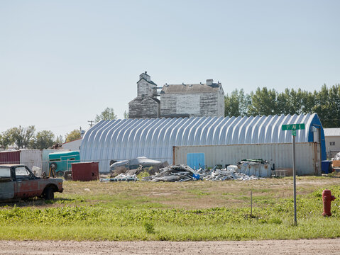Industrial yard with quonset hut and grain elevator