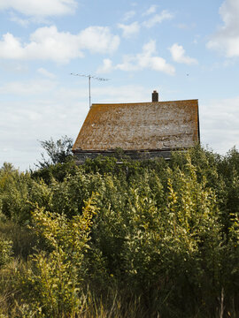 Abandoned wooden house in ghost town prairie