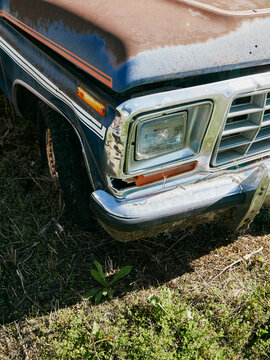 Rusty old truck front detail on grass