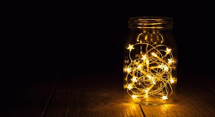 Magical String Lights Illuminating a Glass Jar with Star Shaped Bulbs on a Dark Wooden Surface