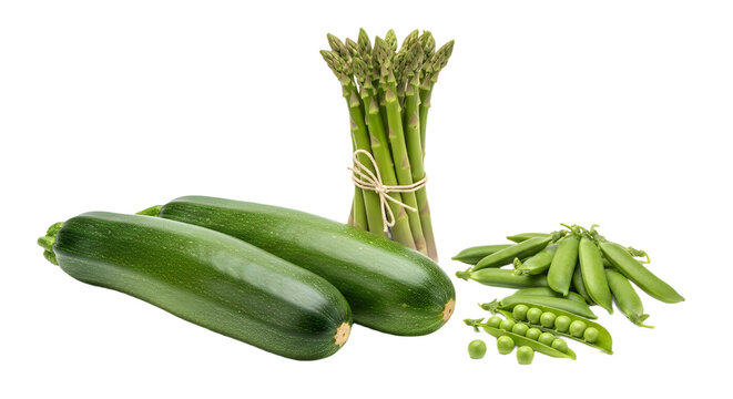 A still life of fresh green vegetables including zucchini asparagus and peas on a black background
