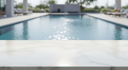 Obraz premium A blurred view of a swimming pool with a marble surface in the foreground on a sunny day outdoors