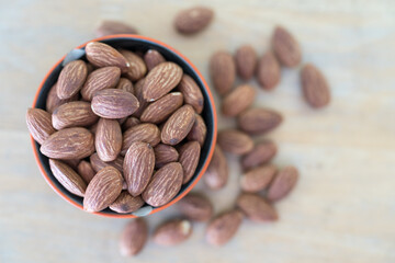 Almond seeds peeled in cup. Top view