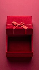 Open Red Gift Box with Ribbon on Matching Background.
