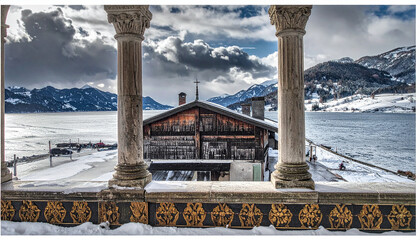 Scenic view of lake by mountains against blue sky
4