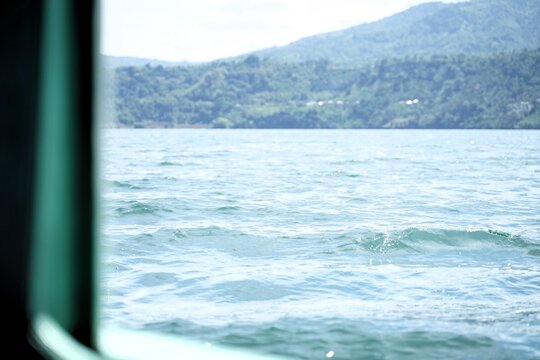 Fototapeta Beautiful views of lakes and hills seen from the ship's window