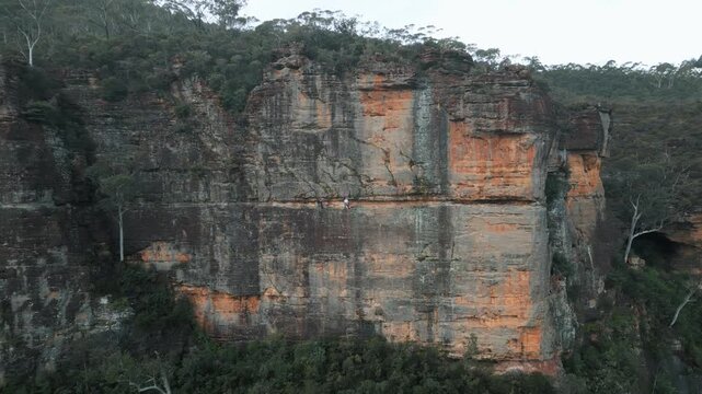 New South Wales, volcanic peaks, summit hikers, geological formations, ancient lava, rugged ridges, basalt structures, Australian landscape, adventure travel, elevated viewpoint, scenic terrain, natur