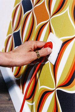 man pushes a red power plug into the socket, 35mm