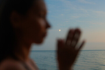 Evening Tranquility by the Water With a Crescent Moon
