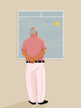 Senior man looking out window at birds and sun
