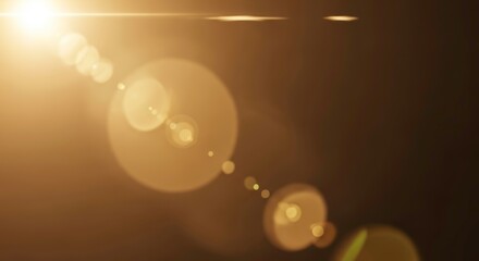 A bright golden lens flare with bokeh effect, creating a warm and abstract light background