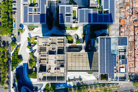 Aerial view of modern building rooftop with solar panels