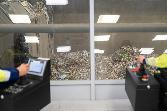 Operators Manage Waste at Recycling Facility 