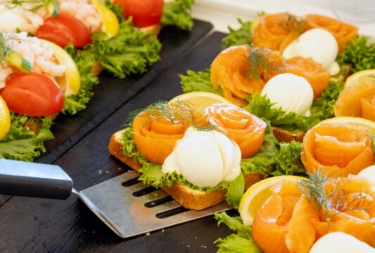 Salmon sandwiches on a tray at the breakfast buffet