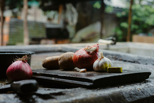 Fresh onions, garlic, potatoes, and bouillon cube 