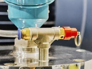 Detailed connection mechanism for industrial equipment showcasing precision engineering at a manufacturing facility