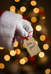 Extreme close-up of Santa Claus’s white glove 