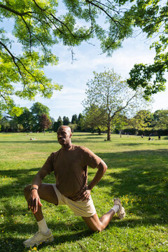 Black man practicing yoga,meditation in the park London