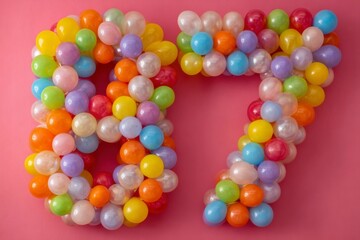 Colorful Display of Balloons Forming the Number 87 on Pink Background