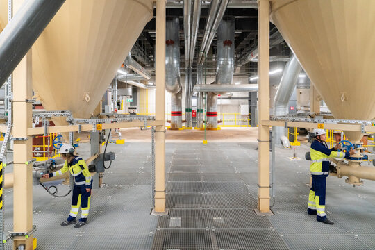 Energy Plant With Technician and Equipment in Operation