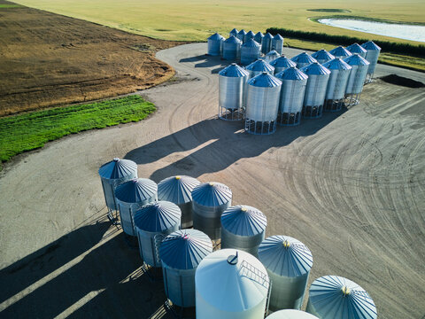 Drone aerial view of grain silos on prairie farmland in Saskatchewan