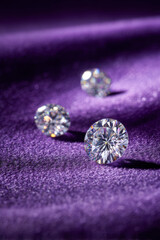 Three cut gems gleam with inner fire on a luxurious velvet backdrop.