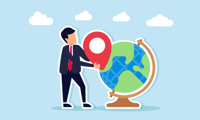 Businessman holding location pin near globe illustration of mapping and projecting potential areas for global business expansion