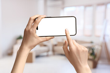 Blurred view of sofas with cardboard boxes in light room on moving day