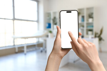 Blurred view of medical office with doctor's workplace and shelf units