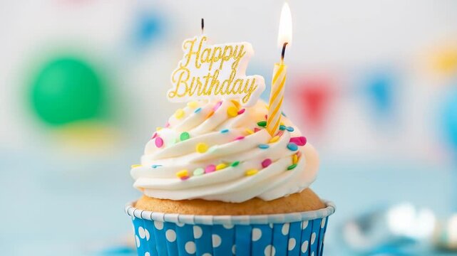 A celebratory cupcake features white frosting, sprinkles, a "Happy Birthday" sign, and lit candle