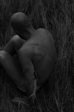 Bodily Form in Natural Grass Setting at Dusk