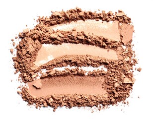 Close-up of three shades of finely powdered cosmetic, scattered on white