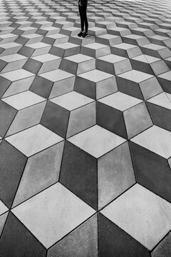 The person's feet are patterned in the form of steps