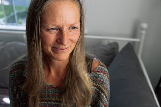 Candid portrait of a woman with a relaxed and thoughtful expression