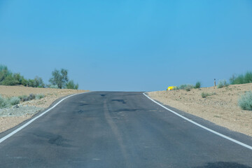 Road through the desert between Jaisalmer and Tanot, near Jaisalmer India.