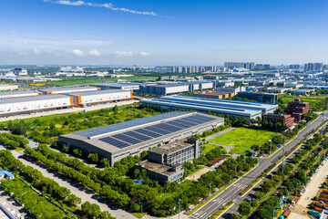 Aerial view of modern industrial park with solar panel rooftops