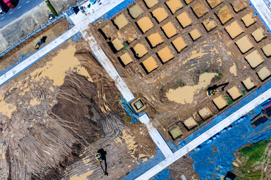 Aerial top view of construction site foundation work