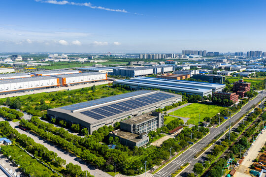 Aerial view of modern industrial park with solar panel rooftops