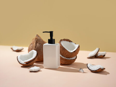 Coconut skincare product display with fresh halves