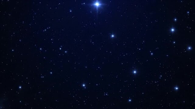 A deep space image featuring numerous twinkling stars scattered across a dark, blue cosmos