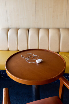 Table with phone charger at cruise boat lounge