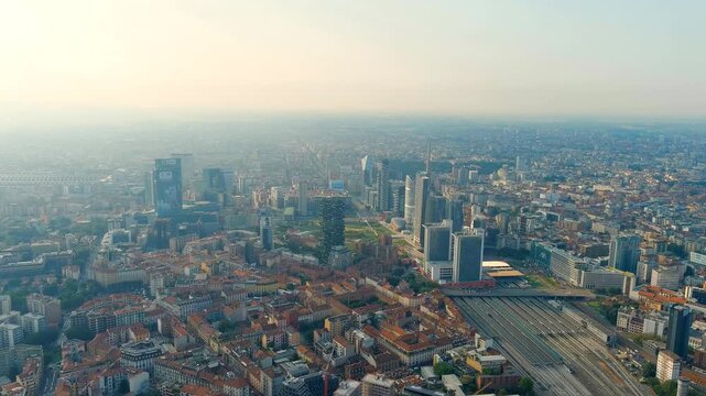 Milan, Italy. The famous skyscrapers of Milan are located around the botanical garden Campo di Fiori BAM. Milano Porta Garibaldi train station. Drone footage