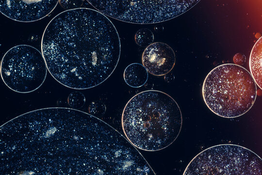 Cells under microscope forming micro cosmos concept background